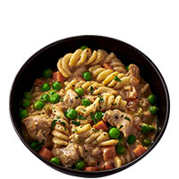 Bowl of creamy chicken pasta with peas and carrots – ready meal by RationTech.
